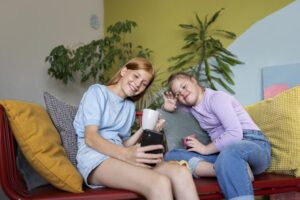 Teen babysitter engaging with child, showing care and trust