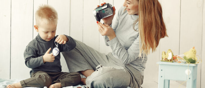 Babysitter doing fun activities with a young child